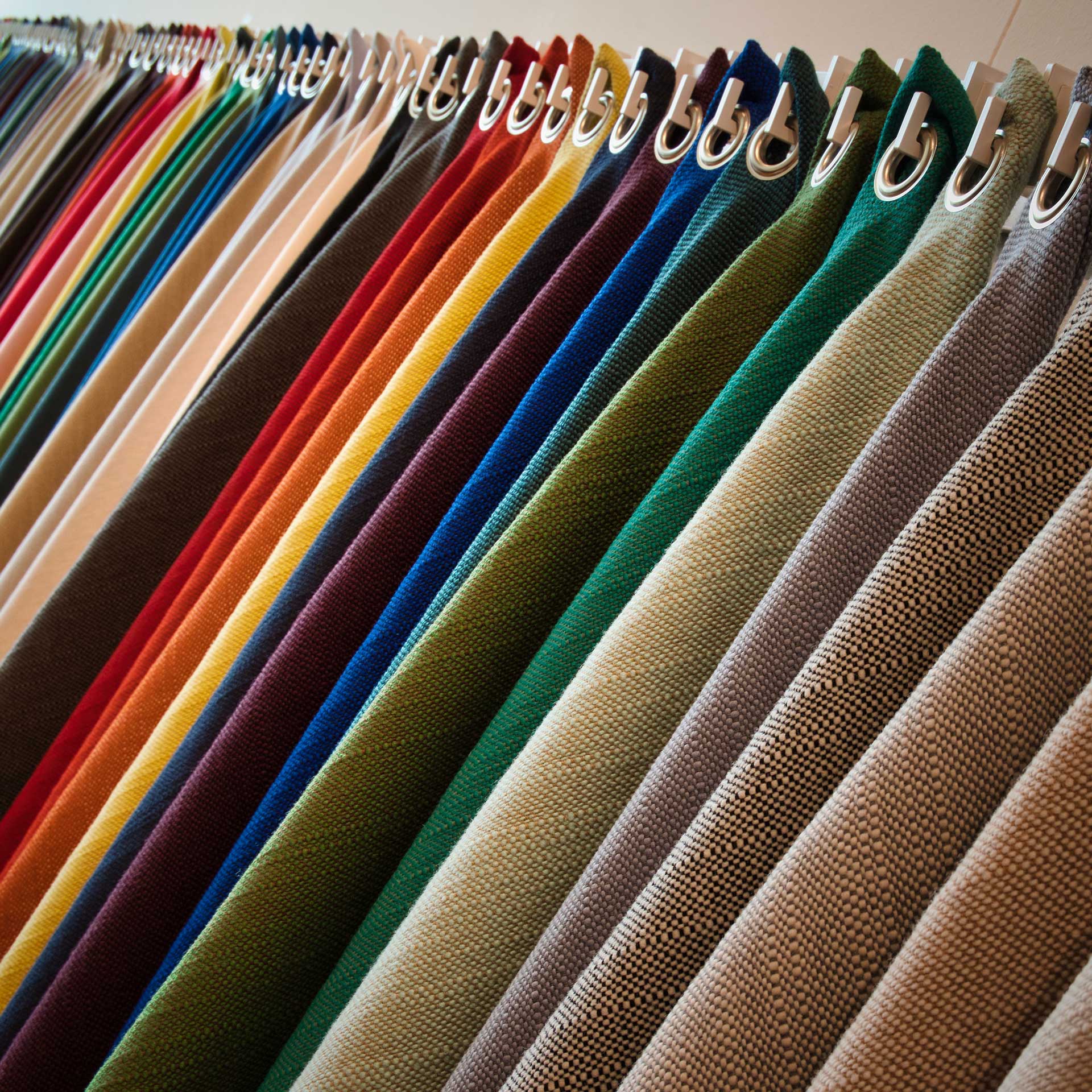 Consultant showing high-quality curtain fabric samples