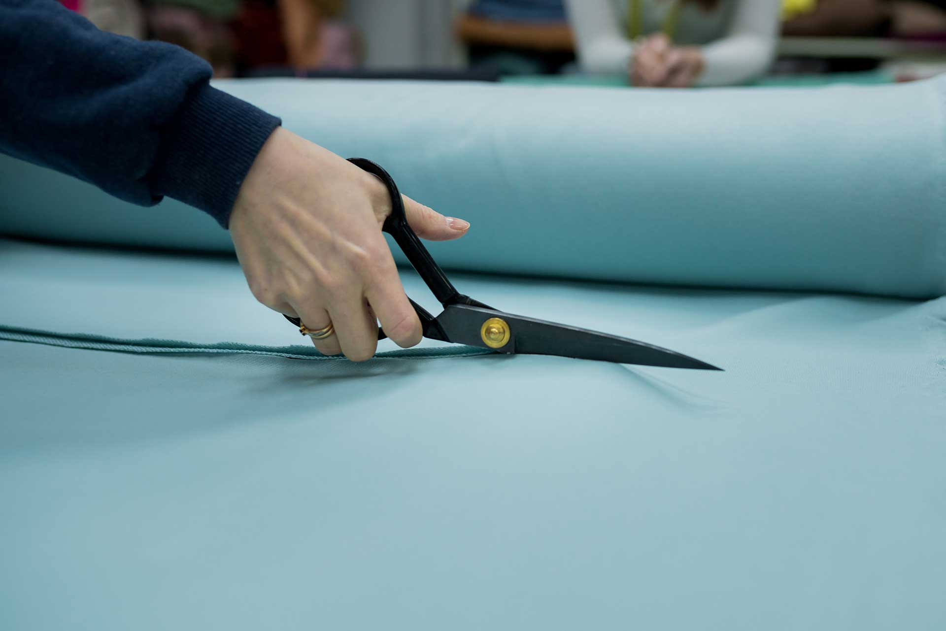 Skilled craftsman working on sofa upholstery in a Dubai workshop